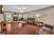 Comfortable living room featuring a stone fireplace and multiple leather sofas and chair at 684 Doe Lane Ln, Loganville, GA 30052