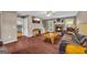 Inviting living room with hardwood floors, stone fireplace, and comfortable seating, perfect for relaxation at 684 Doe Lane Ln, Loganville, GA 30052