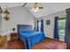 Comfortable main bedroom with wood floors, vaulted ceilings, and ample natural light at 684 Doe Lane Ln, Loganville, GA 30052