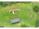Aerial photo of a well maintained park equipped with a playground, swingset, and picnic shelter at 684 Doe Lane Ln, Loganville, GA 30052