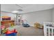 Playroom with gray walls and carpet featuring toys and furniture at 684 Doe Lane Ln, Loganville, GA 30052