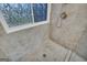 Tiled shower features a rain shower head and hand held sprayer at 684 Doe Lane Ln, Loganville, GA 30052