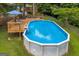 Inviting above-ground pool with wooden deck, lounge chairs and stairs at 684 Doe Lane Ln, Loganville, GA 30052