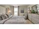 Comfortable bedroom featuring neutral decor, a large window, and tasteful furnishings for a serene retreat at 11899 Aukerman Way, Hampton, GA 30228