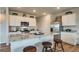 Modern kitchen featuring stainless steel appliances, granite countertops, and a breakfast bar with seating at 11899 Aukerman Way, Hampton, GA 30228