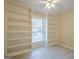 Bright bedroom with built-in bookshelves and a ceiling fan at 1102 Wynnes Ridge Cir, Marietta, GA 30067