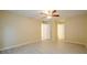 Bedroom featuring gray laminate flooring, a ceiling fan, and two closets at 1102 Wynnes Ridge Cir, Marietta, GA 30067