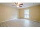 Spacious bedroom with light gray laminate flooring and a ceiling fan at 1102 Wynnes Ridge Cir, Marietta, GA 30067