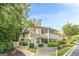 Inviting exterior view of a multi-story condo with neutral siding, screened porches, and well-maintained landscaping at 1102 Wynnes Ridge Cir, Marietta, GA 30067