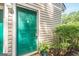 Charming home featuring a bright green front door and landscaped surroundings at 1102 Wynnes Ridge Cir, Marietta, GA 30067