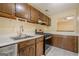 Functional kitchen features wood cabinets, white countertops, stainless steel appliances, and a gas range at 1102 Wynnes Ridge Cir, Marietta, GA 30067