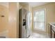 Kitchen view showcases stainless steel refrigerator and a window, brightening the space at 1102 Wynnes Ridge Cir, Marietta, GA 30067