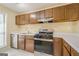 Functional kitchen features wood cabinets, white countertops, stainless steel appliances, and a gas range at 1102 Wynnes Ridge Cir, Marietta, GA 30067