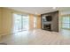 Open living room with balcony access, a fireplace, and views into the kitchen and dining area, featuring light floors at 1102 Wynnes Ridge Cir, Marietta, GA 30067