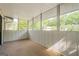 Relaxing screened porch offering a peaceful outdoor retreat with beautiful, tree-lined views at 1102 Wynnes Ridge Cir, Marietta, GA 30067