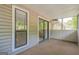Relaxing screened porch, showcasing the sliding door that provides access to the home at 1102 Wynnes Ridge Cir, Marietta, GA 30067