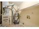 Utility room features a water heater, HVAC system, storage shelf and washer dryer hook-ups, efficiently designed space at 1102 Wynnes Ridge Cir, Marietta, GA 30067