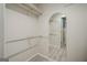 Spacious walk-in closet with ample storage space and wood-look flooring at 1102 Wynnes Ridge Cir, Marietta, GA 30067