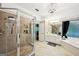 Elegant bathroom showcases a glass shower, separate tub, and updated fixtures at 1285 Willow Park Way, Cumming, GA 30041