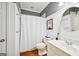 Fresh bathroom with white wainscoting, modern fixtures, and a shower at 1285 Willow Park Way, Cumming, GA 30041