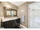 Bathroom with a mosaic-framed mirror, marble vanity, and modern fixtures at 1285 Willow Park Way, Cumming, GA 30041