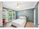 Cozy bedroom with large arched windows and natural light at 1285 Willow Park Way, Cumming, GA 30041