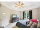 Bright bedroom featuring a ceiling fan, large window, and neutral-toned walls at 1285 Willow Park Way, Cumming, GA 30041