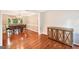 Dining room with hardwood floors, a chandelier, a wooden table with chairs, and a mirrored sideboard at 1285 Willow Park Way, Cumming, GA 30041