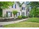 Beautiful home exterior with lush landscaping, a well-maintained lawn, and a welcoming walkway and driveway at 1285 Willow Park Way, Cumming, GA 30041
