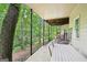 Covered patio featuring outdoor dining and serene wooded views at 1285 Willow Park Way, Cumming, GA 30041