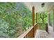 Covered porch overlooking serene wooded backyard at 1285 Willow Park Way, Cumming, GA 30041