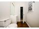 Bathroom featuring a vanity, toilet and an open doorway to another room at 6194 Golden Meadow Court Ct, Riverdale, GA 30296