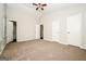 Spacious bedroom with vaulted ceiling, neutral carpet, and multiple closet doors at 6194 Golden Meadow Court Ct, Riverdale, GA 30296