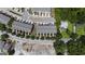Birds-eye view of townhomes with manicured trees, road, and parking spots in a well-maintained neighborhood at 1004 Bayrose Cir, East Point, GA 30344