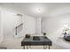 Finished basement with desk, carpet, staircase, open floor plan, and natural light from the window at 1004 Bayrose Cir, East Point, GA 30344