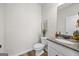 Chic half bathroom featuring a granite countertop, modern fixtures, and elegant decor at 1004 Bayrose Cir, East Point, GA 30344