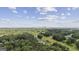 Scenic aerial view of Atlanta skyline beyond lush green treetops on a bright, sunny day at 1004 Bayrose Cir, East Point, GA 30344