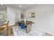 Bright dining area with hardwood floors, a stylish table, and contemporary decor at 1004 Bayrose Cir, East Point, GA 30344