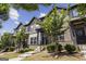 Attractive townhomes with brick and siding, landscaping and inviting entrances at 1004 Bayrose Cir, East Point, GA 30344