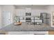 Modern kitchen featuring a large island with a gray granite countertop and stainless steel appliances at 1004 Bayrose Cir, East Point, GA 30344