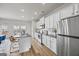 Bright kitchen with stainless steel appliances, gray countertops, and hardwood flooring at 1004 Bayrose Cir, East Point, GA 30344