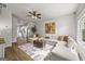 Spacious living room boasting an open layout, a large sofa, and a ceiling fan at 1004 Bayrose Cir, East Point, GA 30344