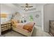 Comfortable main bedroom with tray ceilings, plush carpet, and a decorative headboard at 1004 Bayrose Cir, East Point, GA 30344