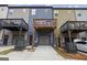 Townhome rear exterior with private back decks, garage, and modern architectural details at 1004 Bayrose Cir, East Point, GA 30344