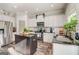 A kitchen with white cabinets, black countertops, a black island and stainless steel appliances at 1753 Liberty Pkwy, Atlanta, GA 30318