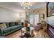 Open-concept living room features stylish furnishings, a fireplace, and plenty of natural light at 1753 Liberty Pkwy, Atlanta, GA 30318