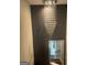 Elegant staircase featuring a modern chandelier and a large mirror at 1753 Liberty Pkwy, Atlanta, GA 30318