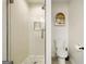 Updated bathroom with a glass-enclosed shower and modern toilet with tiled floors at 2855 Briarlake Ne Rd, Atlanta, GA 30345