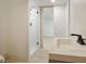 Bright bathroom featuring a modern vanity with sleek fixtures and a glass-enclosed shower at 2855 Briarlake Ne Rd, Atlanta, GA 30345