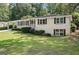 Lovely single-story home with white brick, a covered carport, and a well-manicured lawn at 2855 Briarlake Ne Rd, Atlanta, GA 30345